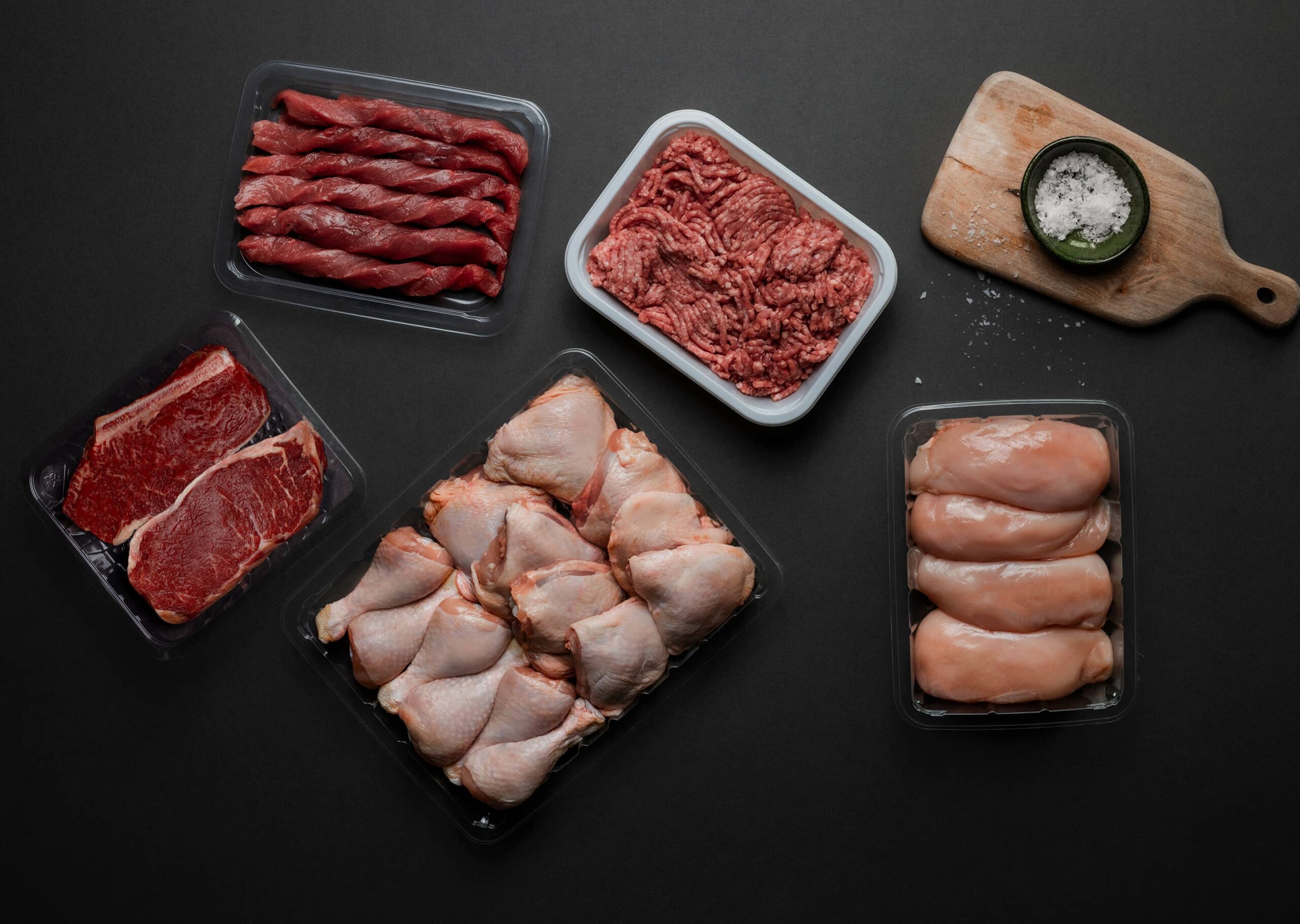 Assorted Yucca Packaging products for meat, seafood and ready meals including modified atmosphere (MAP), vacuum seal, purge-lock open cell, ready meal plastic trays in food processing.