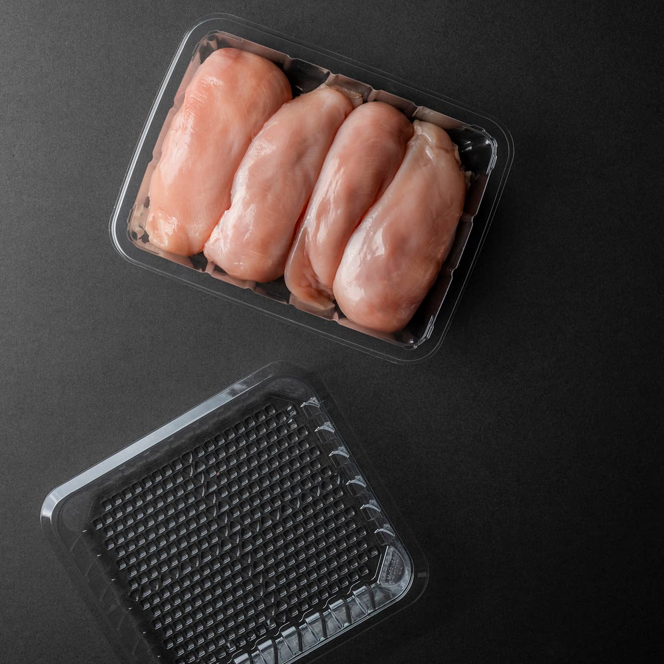 Yucca Packaging purge-lock open cell plastic tray packed with meat.