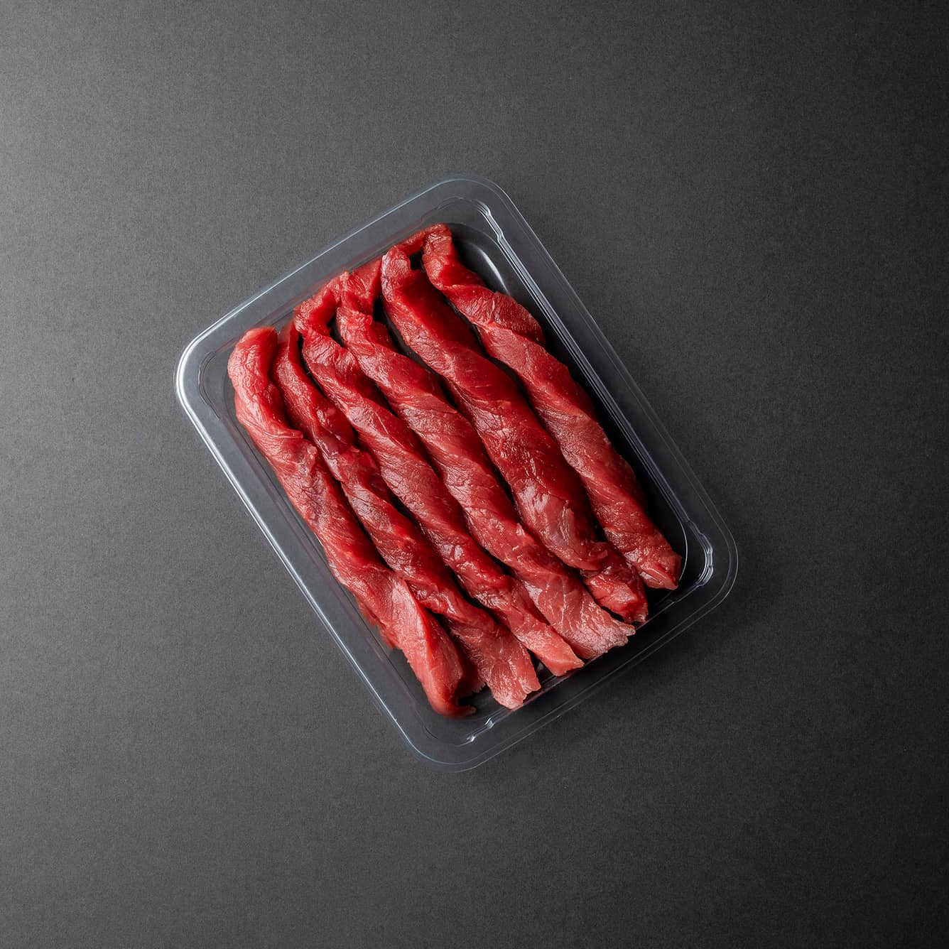 Yucca Packaging vacuum seal plastic tray packed with beef goulash.