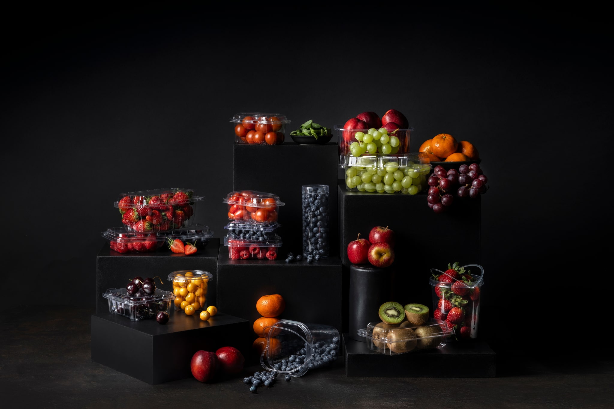 Assorted Yucca Packaging products for packing blueberries, cherry tomatoes, strawberries, kiwi, gooseberry, avocado, cherries, grapes and more in plastic packaging in agriculture.